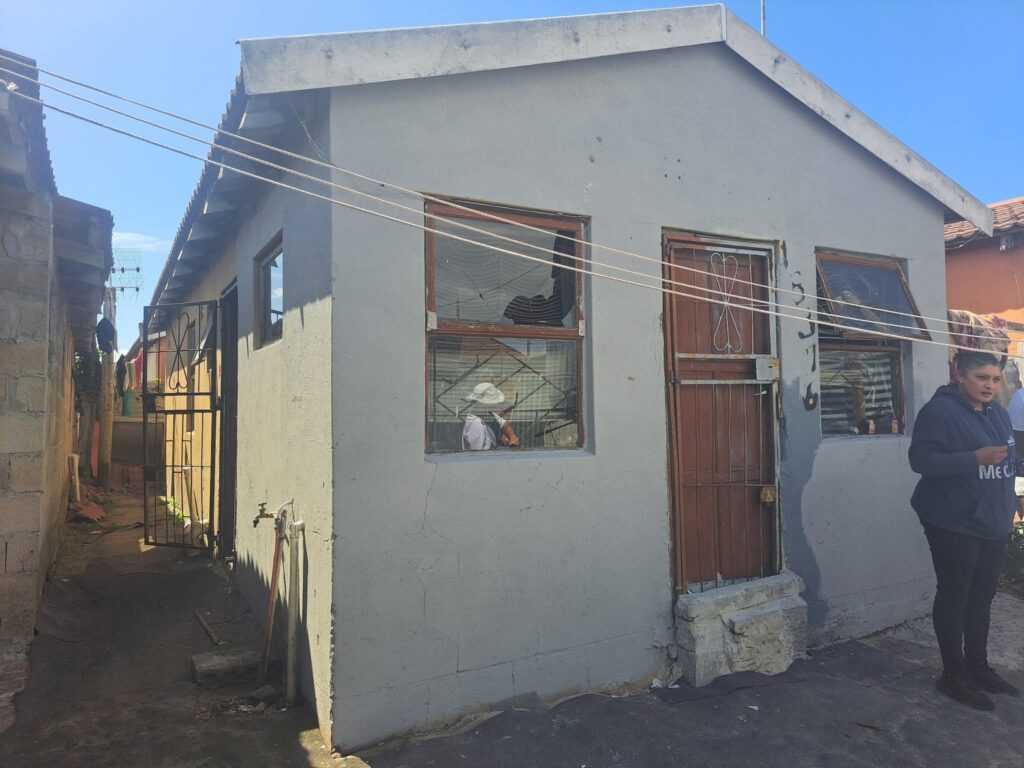 Police investigate the scene of the Philippi East shooting where seven men were killed.